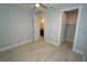 Bedroom with wood-look tile flooring, and access to bathroom and closet at 490 Sorrento Ct, Punta Gorda, FL 33950