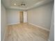 Large bedroom with wood-look tile flooring and an ensuite bathroom at 490 Sorrento Ct, Punta Gorda, FL 33950