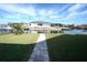 View of canal and walkway leading to the house at 490 Sorrento Ct, Punta Gorda, FL 33950