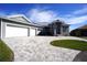 Three-car garage and paver driveway with curb appeal at 490 Sorrento Ct, Punta Gorda, FL 33950