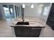 Large kitchen island with granite countertop and modern sink at 490 Sorrento Ct, Punta Gorda, FL 33950