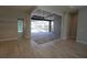 Living room with sliding glass doors opening to the pool area at 490 Sorrento Ct, Punta Gorda, FL 33950