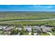 Bird's-eye view of a waterfront home with lush green surroundings at 5028 San Massimo Dr, Punta Gorda, FL 33950