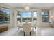 Bright breakfast nook with pool view, seating for four, and large windows at 5028 San Massimo Dr, Punta Gorda, FL 33950