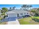 Single-story home with tile roof and landscaped yard in a waterfront community at 525 Port Bendres Dr, Punta Gorda, FL 33950