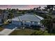 Single-story home with tile roof and landscaped yard in a waterfront community at 525 Port Bendres Dr, Punta Gorda, FL 33950