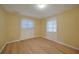 Light and airy bedroom with light wood laminate flooring and neutral walls at 525 Port Bendres Dr, Punta Gorda, FL 33950