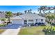 Single-story home with tile roof and landscaped yard at 525 Port Bendres Dr, Punta Gorda, FL 33950