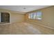 Living room with tile floors and large window at 525 Port Bendres Dr, Punta Gorda, FL 33950