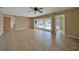 Living room with tile floors, sliding doors that open to a pool and canal at 525 Port Bendres Dr, Punta Gorda, FL 33950