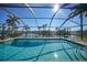 Inviting screened-in pool with stunning canal views at 525 Port Bendres Dr, Punta Gorda, FL 33950