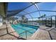 Sparkling pool with screened enclosure and water views at 525 Port Bendres Dr, Punta Gorda, FL 33950