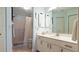 Clean bathroom with single vanity and shower at 5725 Greenwood Ave # 7203, North Port, FL 34287