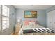 Bright bedroom with a queen-size bed and plenty of natural light at 5725 Greenwood Ave # 7203, North Port, FL 34287