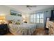 Bright bedroom with a comfortable bed and plenty of natural light at 5725 Greenwood Ave # 7203, North Port, FL 34287