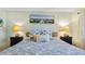 Main bedroom with a king-size bed and stylish decor at 5725 Greenwood Ave # 7203, North Port, FL 34287