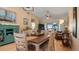 Dining room with light wood table and chairs at 5725 Greenwood Ave # 7203, North Port, FL 34287