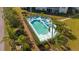 Refreshing community pool with surrounding patio furniture at 5725 Greenwood Ave # 7203, North Port, FL 34287