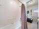 Bathroom with a tub, shower, and view of a sitting area at 700 Gardens Edge Dr # 722, Venice, FL 34285