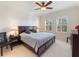 Spacious bedroom with a king-size bed and window shutters at 700 Gardens Edge Dr # 722, Venice, FL 34285