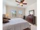 Bright bedroom with a king-size bed and dresser at 700 Gardens Edge Dr # 722, Venice, FL 34285