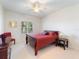 Bright bedroom with a full-size bed, nightstands, and a dresser at 700 Gardens Edge Dr # 722, Venice, FL 34285