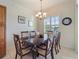 Bright dining room with a large table and six chairs at 700 Gardens Edge Dr # 722, Venice, FL 34285