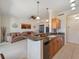 Open kitchen features granite countertops and modern appliances at 700 Gardens Edge Dr # 722, Venice, FL 34285