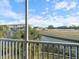 Waterfront view from the lanai, featuring a pond and lush landscape at 700 Gardens Edge Dr # 722, Venice, FL 34285