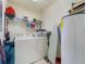 Laundry room with washer, dryer, and storage shelves at 700 Gardens Edge Dr # 722, Venice, FL 34285