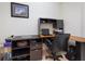 Home office with a corner desk, laptop and printer at 700 Gardens Edge Dr # 722, Venice, FL 34285