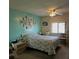 Serene bedroom featuring soft color scheme, ceiling fan, and ample natural light at 735 Blackburn Blvd, North Port, FL 34287