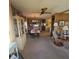 Dining area adjacent to the kitchen featuring a display cabinet and comfortable seating at 735 Blackburn Blvd, North Port, FL 34287