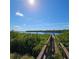 Wooden dock extending over calm water at 735 Blackburn Blvd, North Port, FL 34287