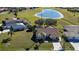 Aerial view of single-Gathering home with pool and heart-shaped lake nearby at 7352 Parkinsonia, Punta Gorda, FL 33955