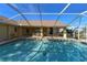 Refreshing screened pool with patio and view of landscape at 7352 Parkinsonia, Punta Gorda, FL 33955