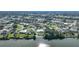 Aerial view of waterfront home in residential neighborhood at 7435 Snow Dr, Englewood, FL 34224