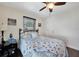 Guest bedroom with ceiling fan and light blue bedding at 7435 Snow Dr, Englewood, FL 34224