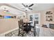 Bright dining area with table and chairs, adjacent to kitchen and patio at 7435 Snow Dr, Englewood, FL 34224