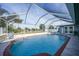 Inviting screened pool with ample deck space at 7435 Snow Dr, Englewood, FL 34224