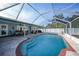 Refreshing screened pool with extended patio and seating at 7435 Snow Dr, Englewood, FL 34224