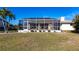 Large backyard, screened pool and patio at 900 Genoa Ct, Punta Gorda, FL 33950