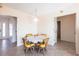 Small breakfast nook with yellow chairs and round table at 900 Genoa Ct, Punta Gorda, FL 33950