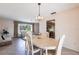 Bright dining room with table and chairs, kitchen view, and natural light at 900 Genoa Ct, Punta Gorda, FL 33950