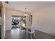 Dining room with pool view, sliding glass doors, and a chandelier at 900 Genoa Ct, Punta Gorda, FL 33950