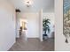 Bright entryway with tiled flooring, featuring a plant and view into the living room at 900 Genoa Ct, Punta Gorda, FL 33950