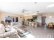 Open living room showcasing a kitchen, breakfast area, and view to backyard at 900 Genoa Ct, Punta Gorda, FL 33950