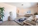 Comfortable living room with tiled flooring, featuring a sofa and large window at 900 Genoa Ct, Punta Gorda, FL 33950