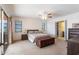 Main bedroom with ensuite bathroom and access to a balcony at 900 Genoa Ct, Punta Gorda, FL 33950