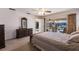 Main bedroom with stunning pool and canal views from the balcony at 900 Genoa Ct, Punta Gorda, FL 33950